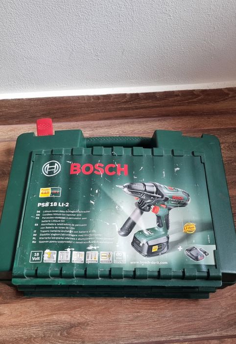 Mașină de găurit cu percuție marca Bosch cu acumulator litiu-ion 18V