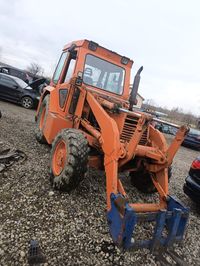 Buldo excavator încărcător frontal cu cupa