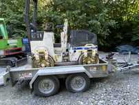 Cilindru compactor bomag cu dumper ausa si remorca