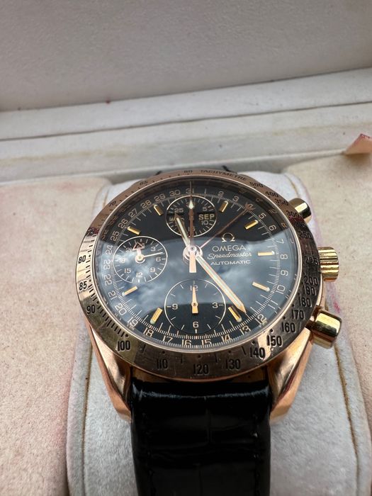 Омега Omega speedmaster day date. 18к златен мъжки часовник.