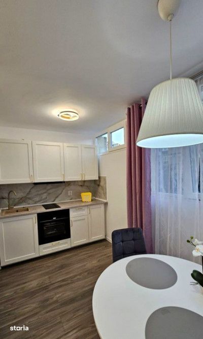 Garsoniera ultrafinisata cu balcon si vedere vestica ,confort si stil