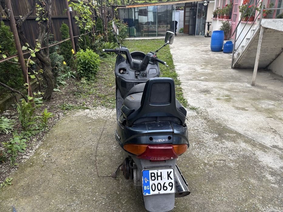 Vand sau schimb  suzuki burgman 400cc
