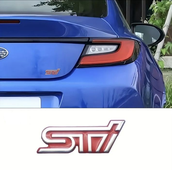 Memaʌнa емблема STI за Subaru.
Ipogykma e om Hau-Bucok kʌac.