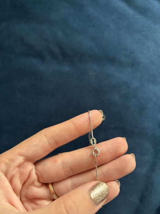 Сребърно колие със синьо око против уроки