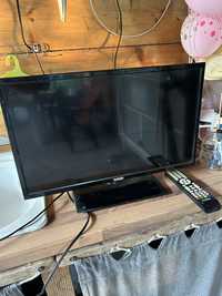 Televizor LED marca EXCLUSIV, diagonala de 56 cm si telecomanda TV
