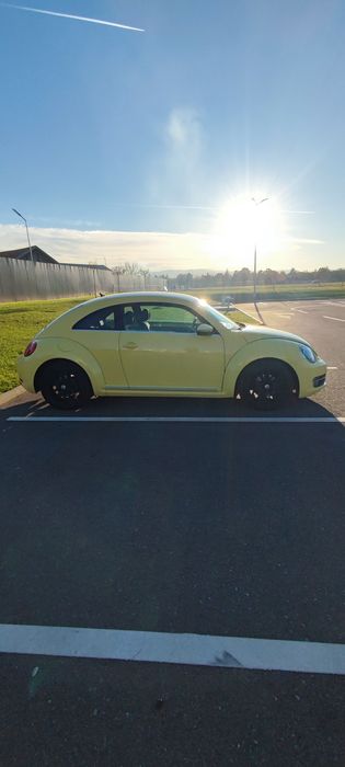 VW BEETLE 1.2 BENZINA 105 CP
2 geamuri electrice
dublu climatronic
sen