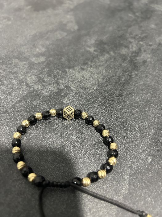 Bratara cu bilute din aur si zar cu pietricele negre din aur