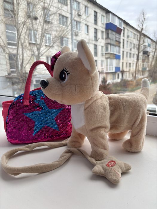 Продам игрушку собачка  в сумочке