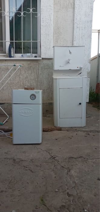 Продам котёл б/у на 100 кв.м  и умывальник электрический