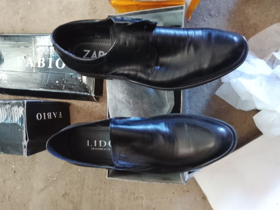 Продам мужские туфли кожаные, фирменные, черного цвета новые .