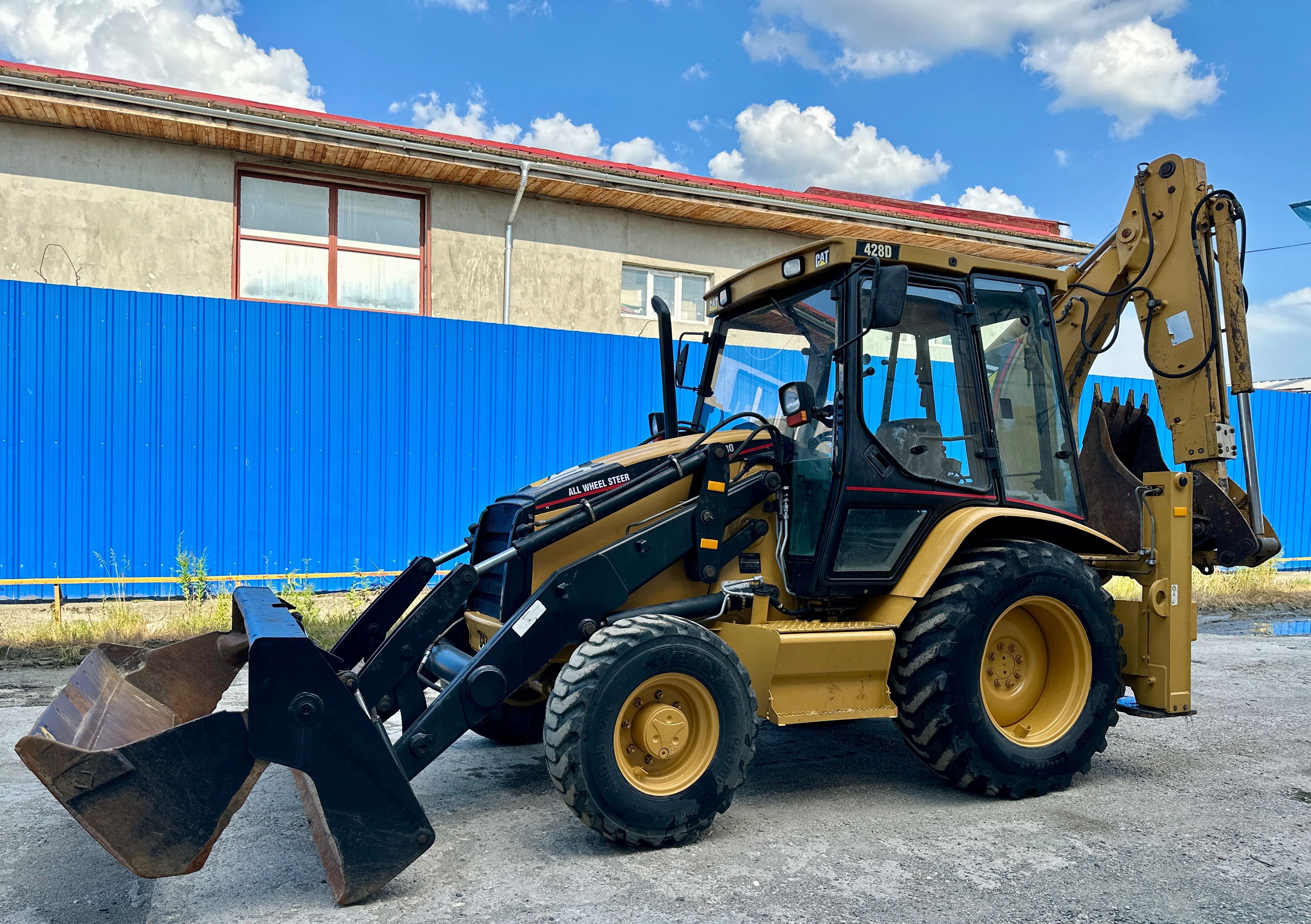 Buldoexcavator Cat / Caterpillar 428D
