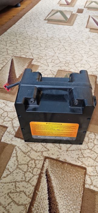 Cărucior electric pentru deplasare persoane cu dizabilități