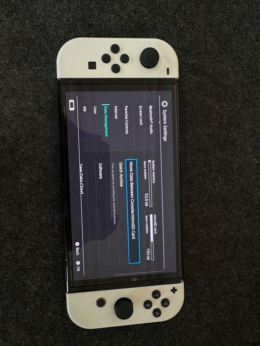 Nintendo Switch OLED - White + 30 дигитални игри и подарък волан