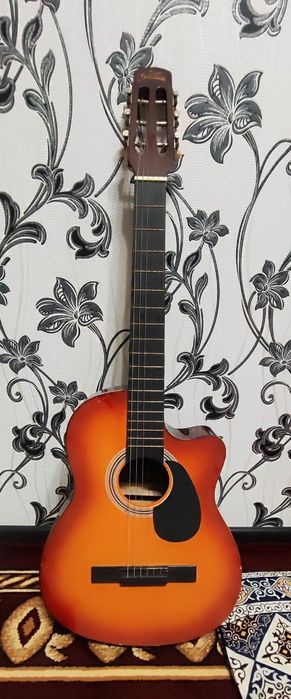 Гитара струнасын ауыстру керек