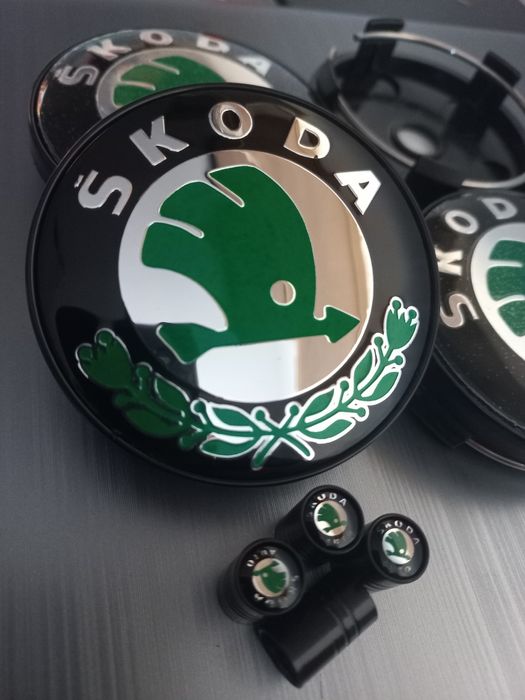Skoda - skoda/vrs-Set 4 capace  si ventile pentru jante aliaj.
