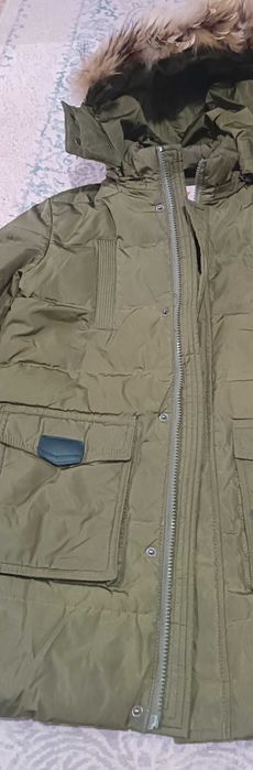 Продам пуховик  в отличном состоянии 8-10 лет