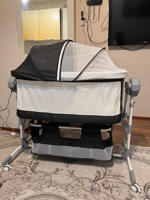 Детская электрическая кроватка