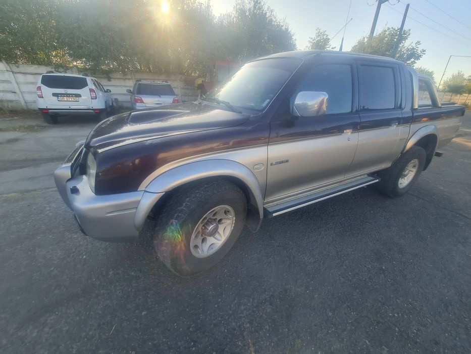 Mitsubishi L200 2005 116 hp