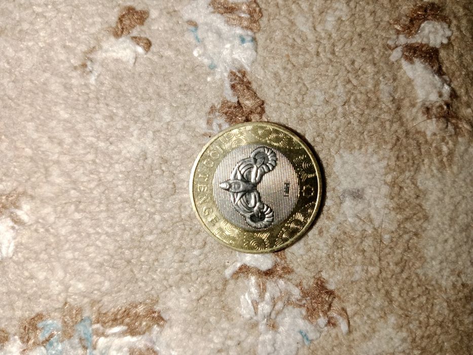 Коллекционная монета 100 ТГ цена договорная