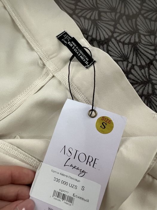 Женские брюки палаццо молочного цвета