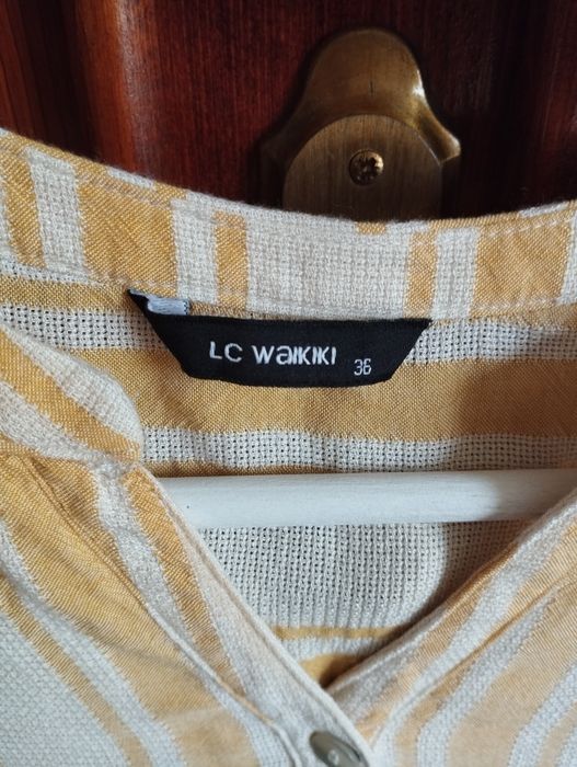 Bluză de culoare bej cu dungi verticale de culoare galbenă, mărimea 36