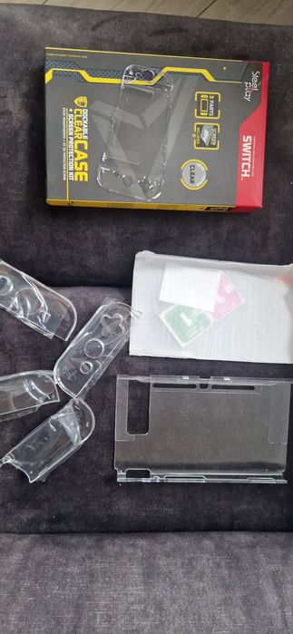 Set Nintendo Switch Joy-Con Charging Grip + carcasa protectie