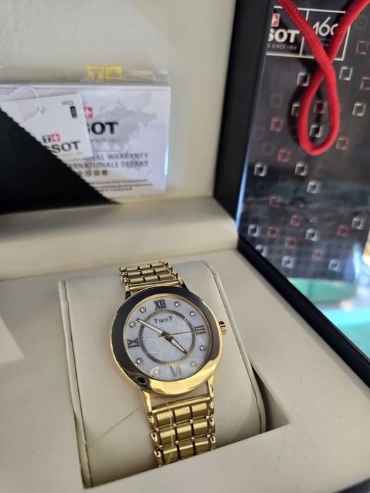 Продам классические часы Tissot в золоте 750 пробы