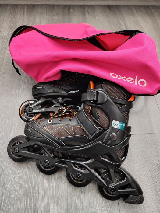 Role oxelo cu geanta transport roz