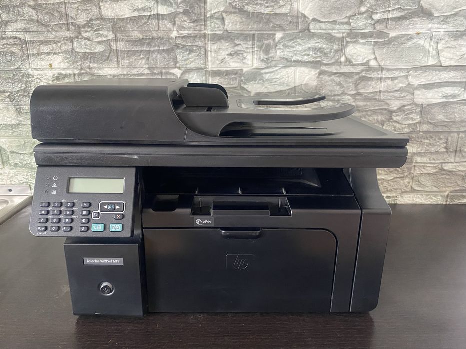Imprimantă HP LaserJet M1212nf MFP Functionaza excelent si calitate