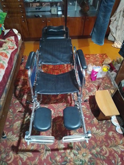 Инвалидная коляска.