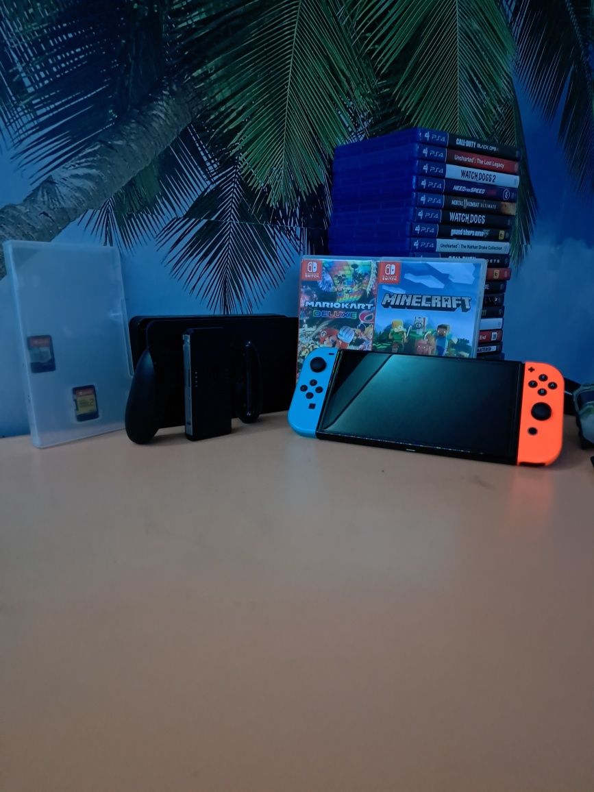 Vand/schimb Nintendo switch oled cu 4 jocuri + accesorii