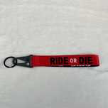 Ключодържател "RIDE OR DIE" – Червен текстилен таг с карабинер