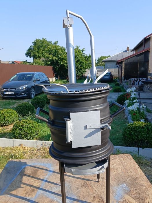 Gătește ca-n natură! Sobiță tip Godin cu grătar reglabil – 650 RON