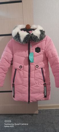 Продам новую зимнюю куртку на девочку ростовка 152, цена 12 000 тенге.