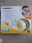 Medela Двойна двуфазна електрическа помпа за кърма Swing maxi