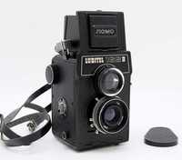 Плёночный фотоаппарат советских времён.