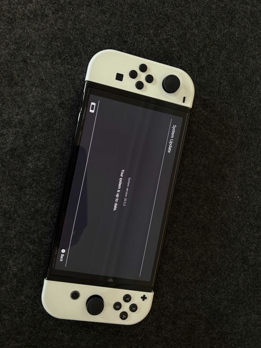 Nintendo Switch OLED - White + 30 дигитални игри и подарък волан