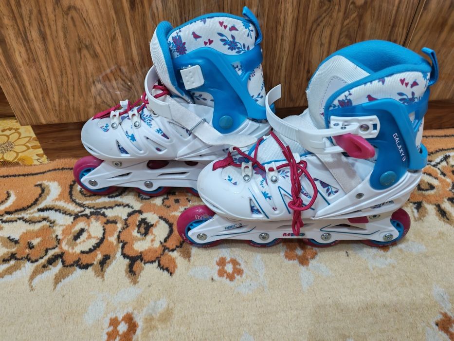 Роликовые коньки