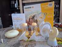 Двуфазна двойна помпа за кърма Medela