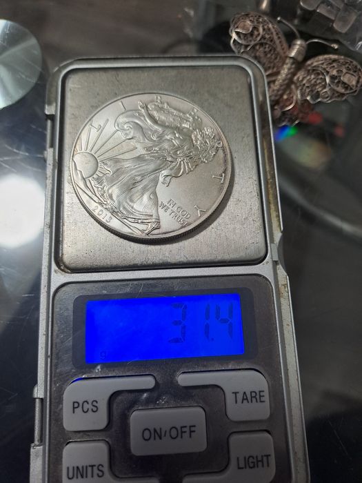 Vand moneda de argint