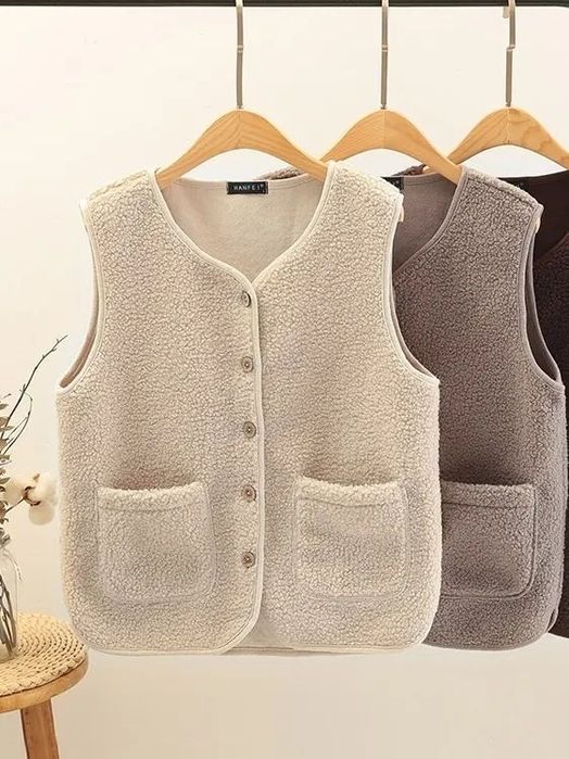 Жилетки женские теплые