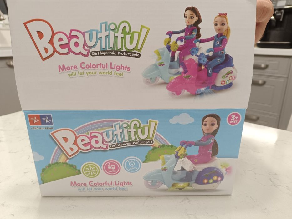 Papusa cu motocicleta cu lumini si sunete