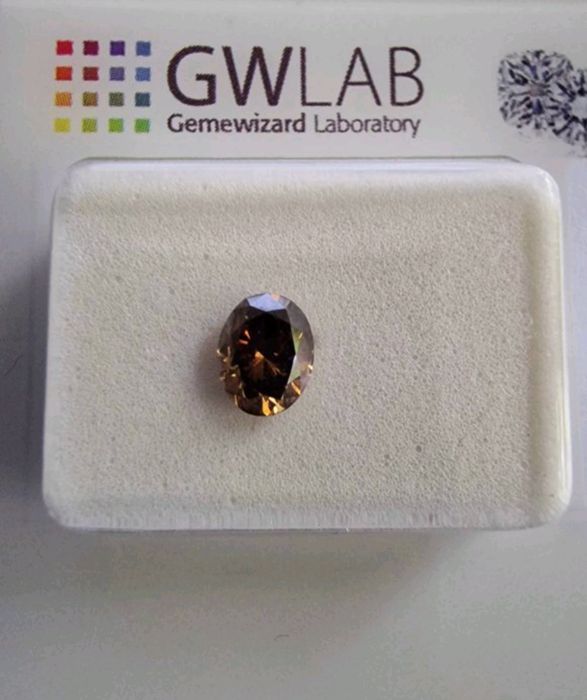 Diamant 0.5 Ct oval Fancy Maroniu Portocaliu închis