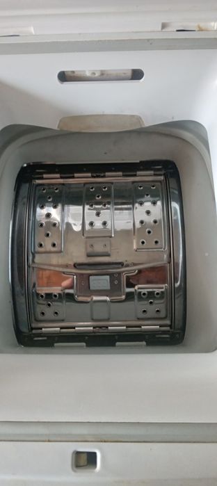 Mașină cu încărcare verticală