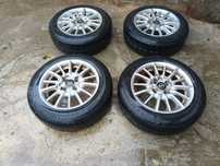 SET JANTE ALIAJ R 14 4x100 + cauciucuri 165-65 R 14