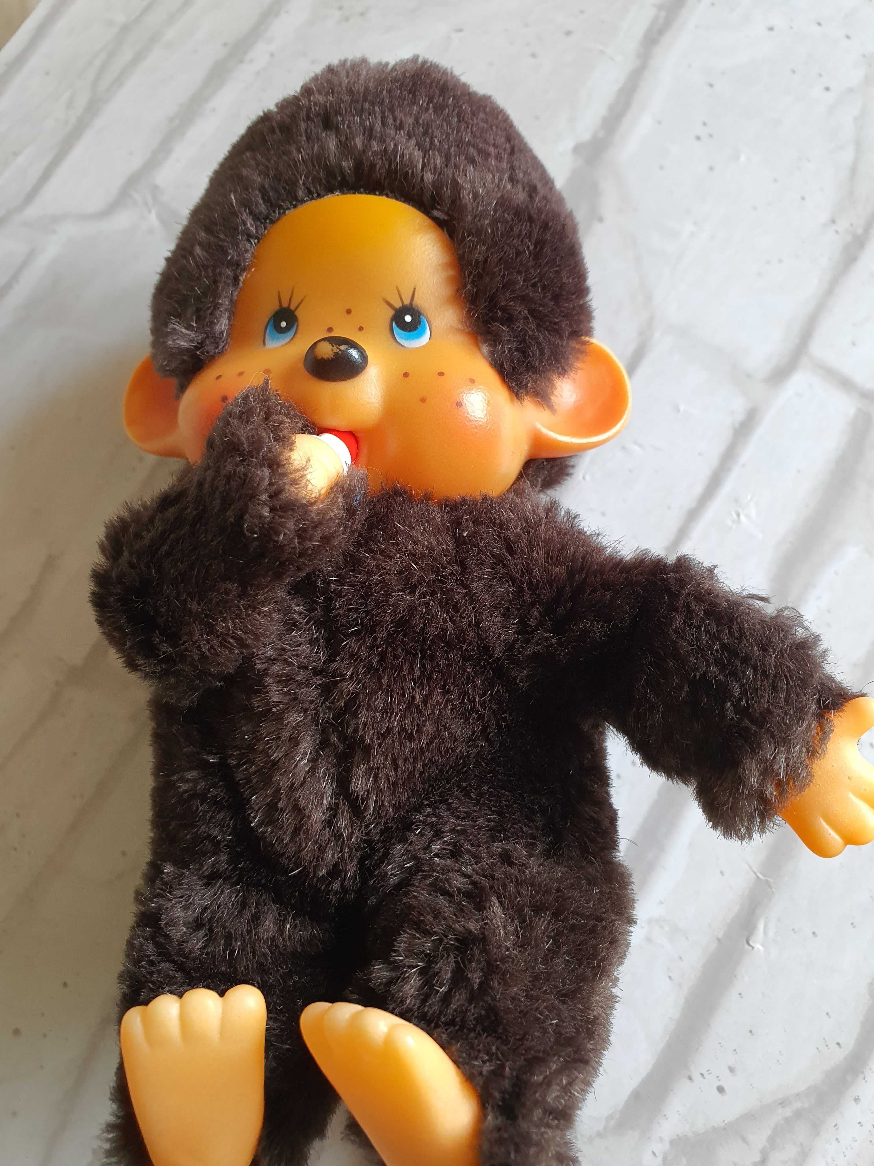 Bebe Monchhichi din plus culoare maro cu suzeta