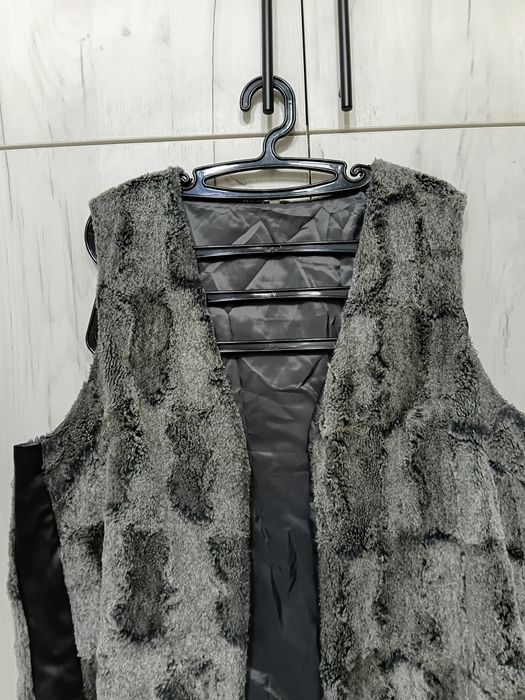 Елек с кожени елементи