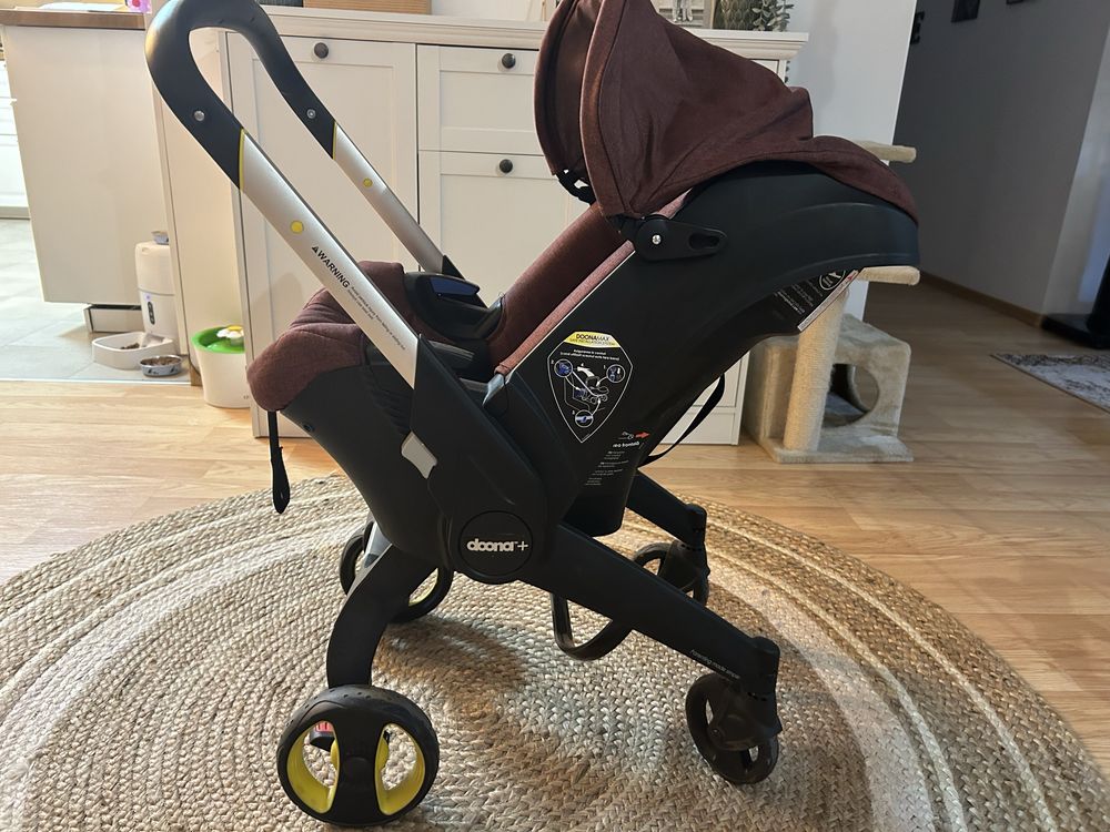 Carucior bebe scaun auto scoica Doona