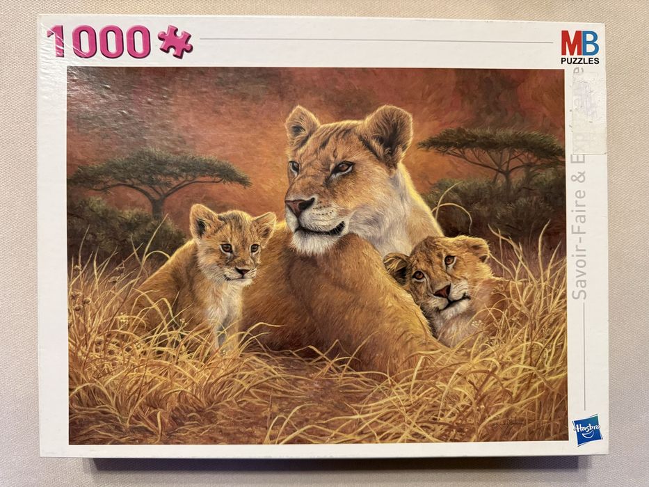 Puzzle 1000 piese Familie de lei in savana - nou