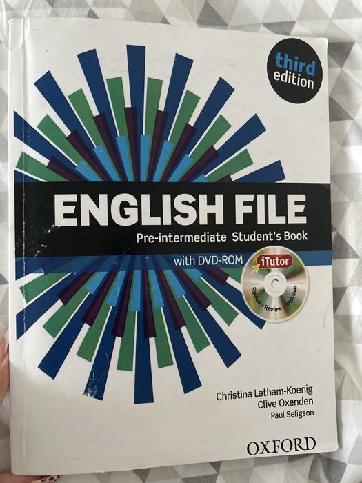 English file pre-intermediate , workbook , students book .